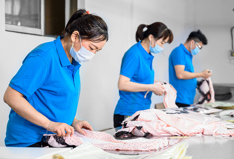 workers inspecting products