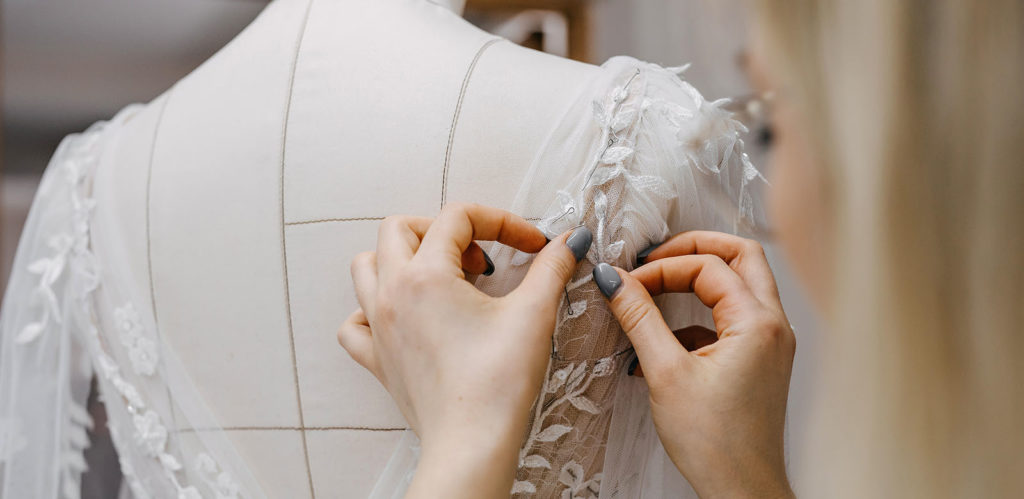 tailor making a dress