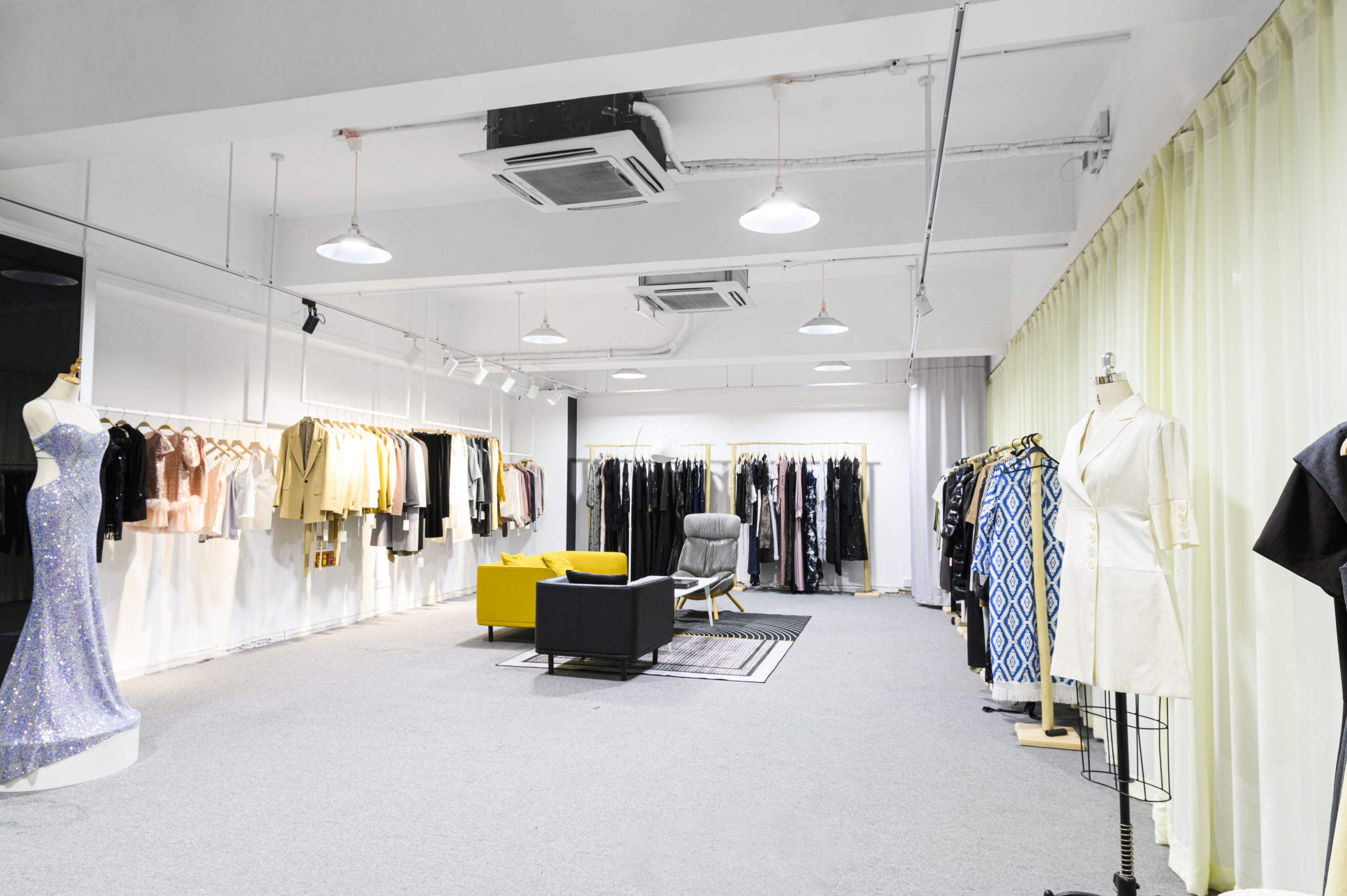 Showroom with garment racks and mannequins