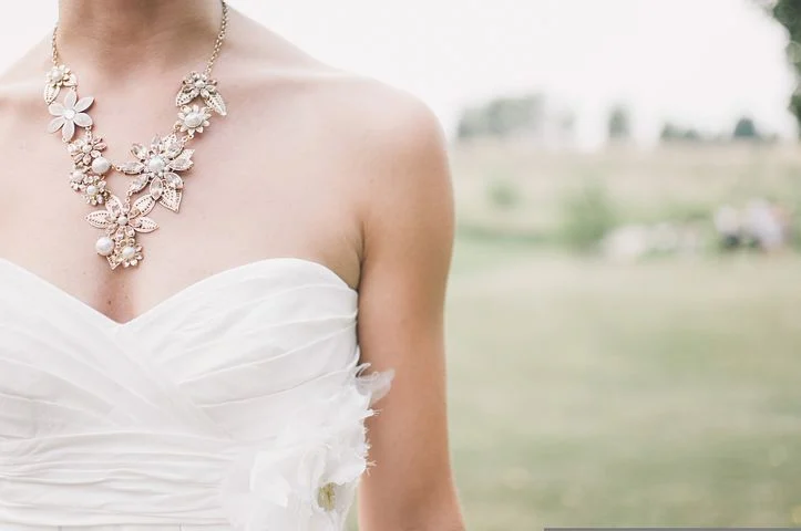 large diamond necklace on a girl's neck