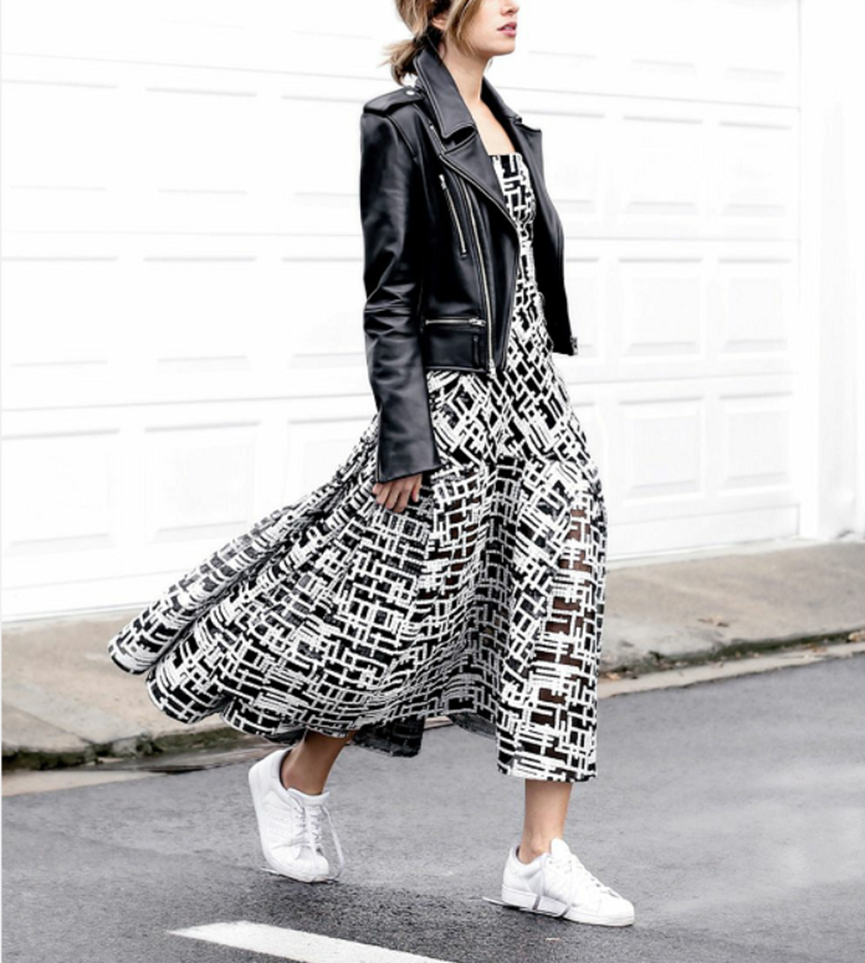 Woman in midi dress and white sneakers