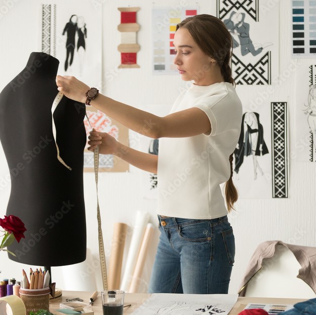 a woman designing the clothing